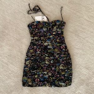 Black dress with stamp flowers. Mini dress.